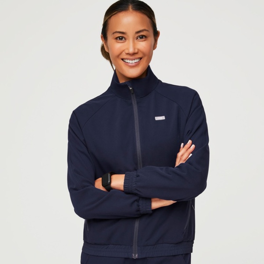 Performance navy FIGS scrub jacket